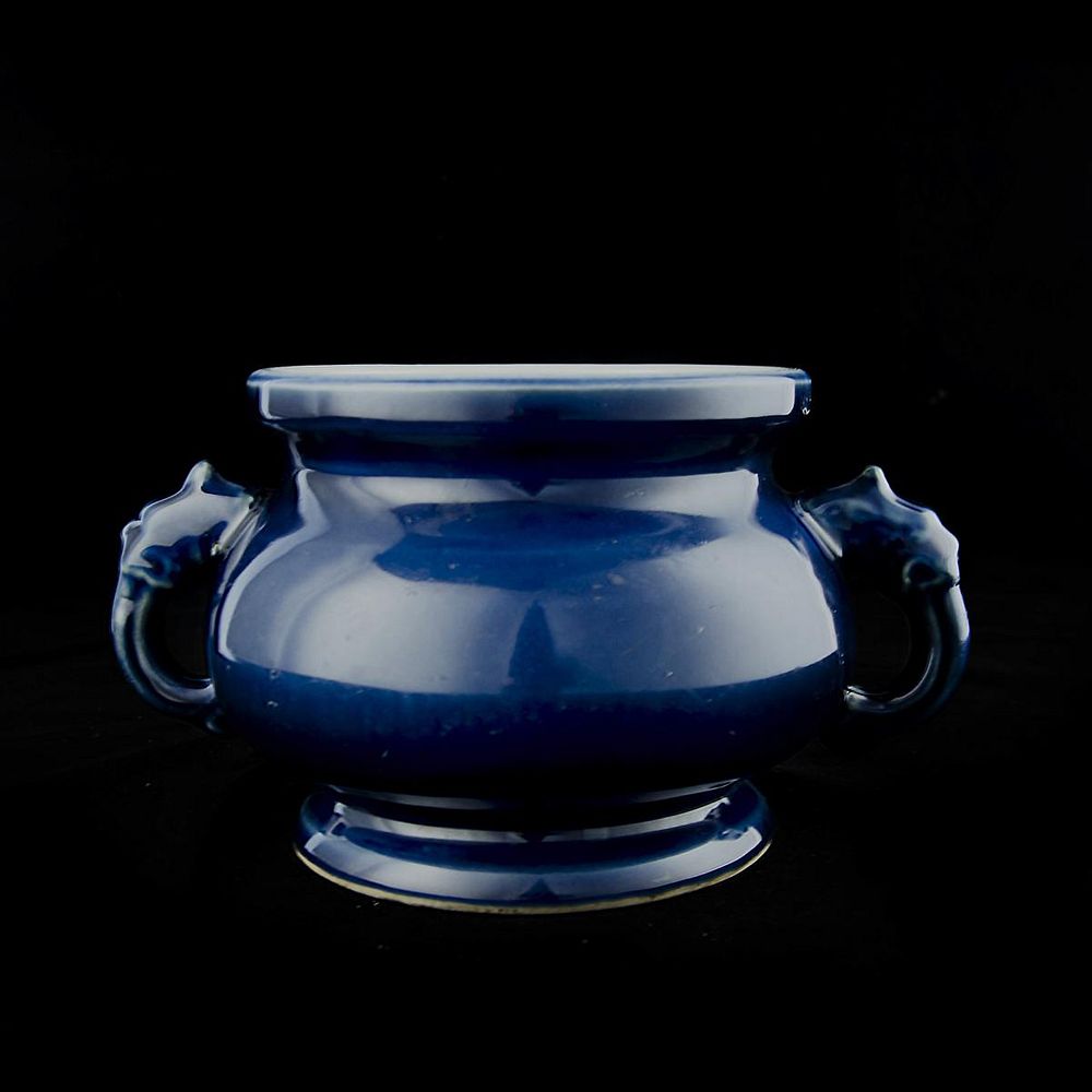 Appraisal: CHINESE COBALT GLAZED PORCELAIN HANDLED URN A Chinese cobalt blue