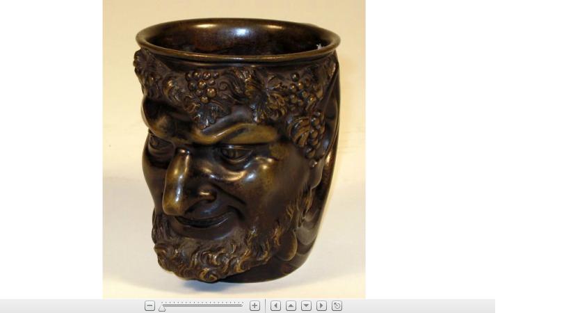 Appraisal: Continental bronze Bacchus cupDark brown patina modeled as The head