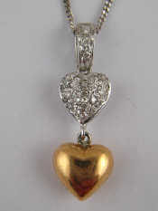 Appraisal: A yellow and white metal tests carat gold diamond heart