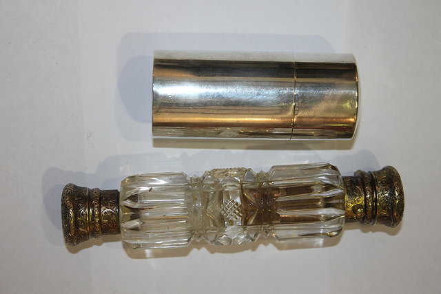 Appraisal: A VICTORIAN CUT GLASS DOUBLE ENDED SCENT BOTTLE with silver