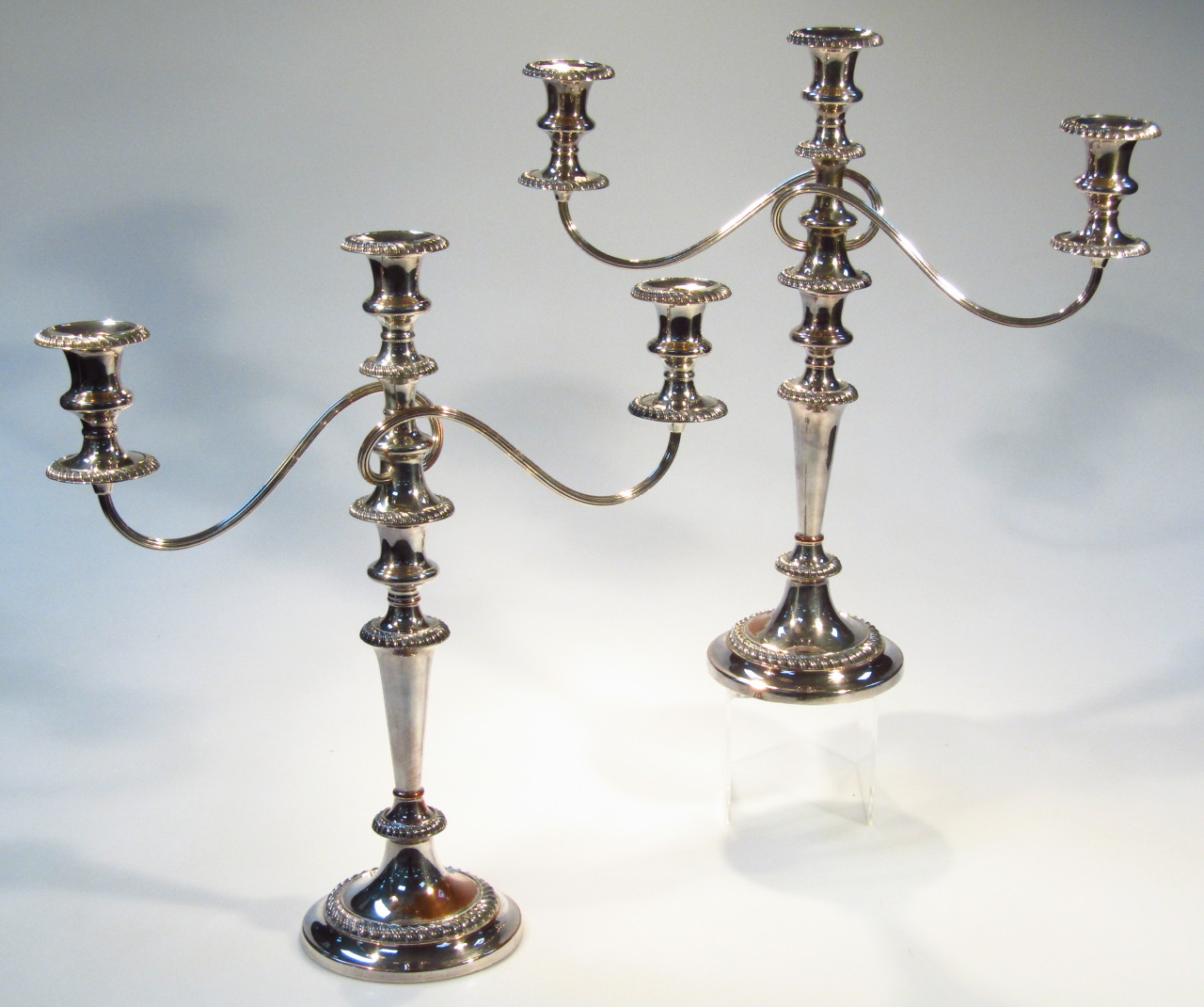 Appraisal: A pair of early thC silver plated three branch candelabra