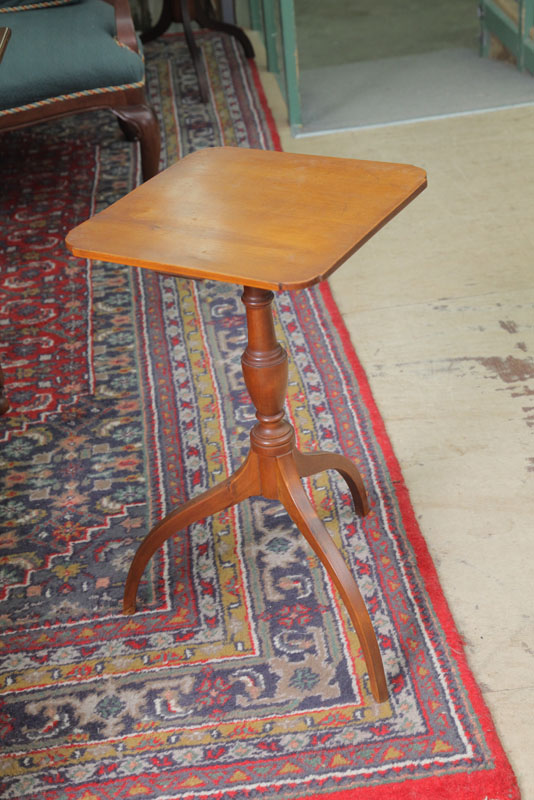 Appraisal: CANDLESTAND Walnut having a square top with curved corners on