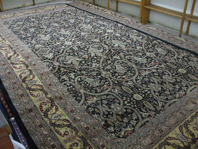 Appraisal: LARGE ORIENTAL INDO-PERSIAN CARPET having an overall floral decorated black