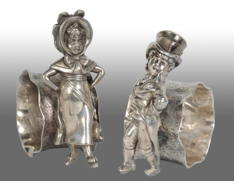 Appraisal: Lot of Figural Napkin Rings Description Includes a boy and