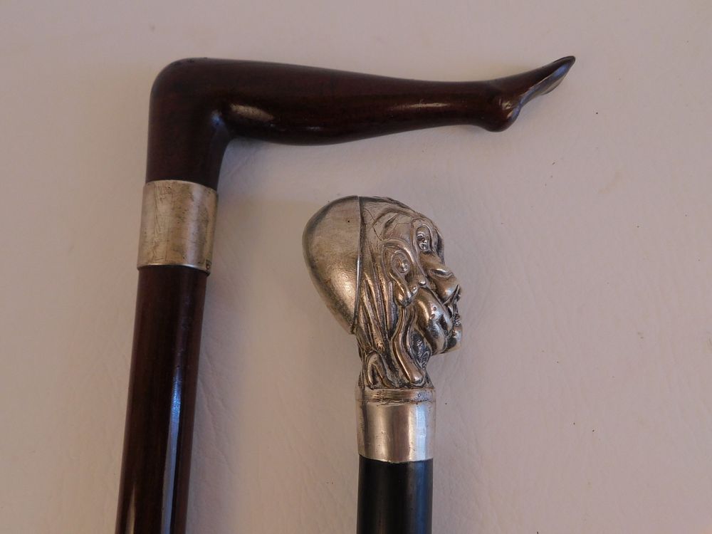 Appraisal: LADY'S LEG EROTIC BUST CANES old canes including carved wood