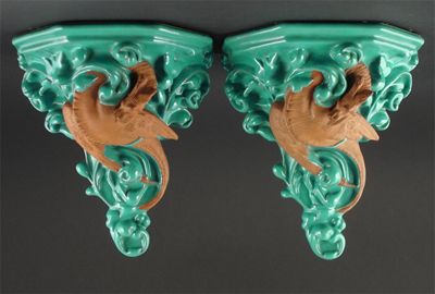 Appraisal: Two Watcombe Torquay terracotta wall brackets modelled with mythical dragon