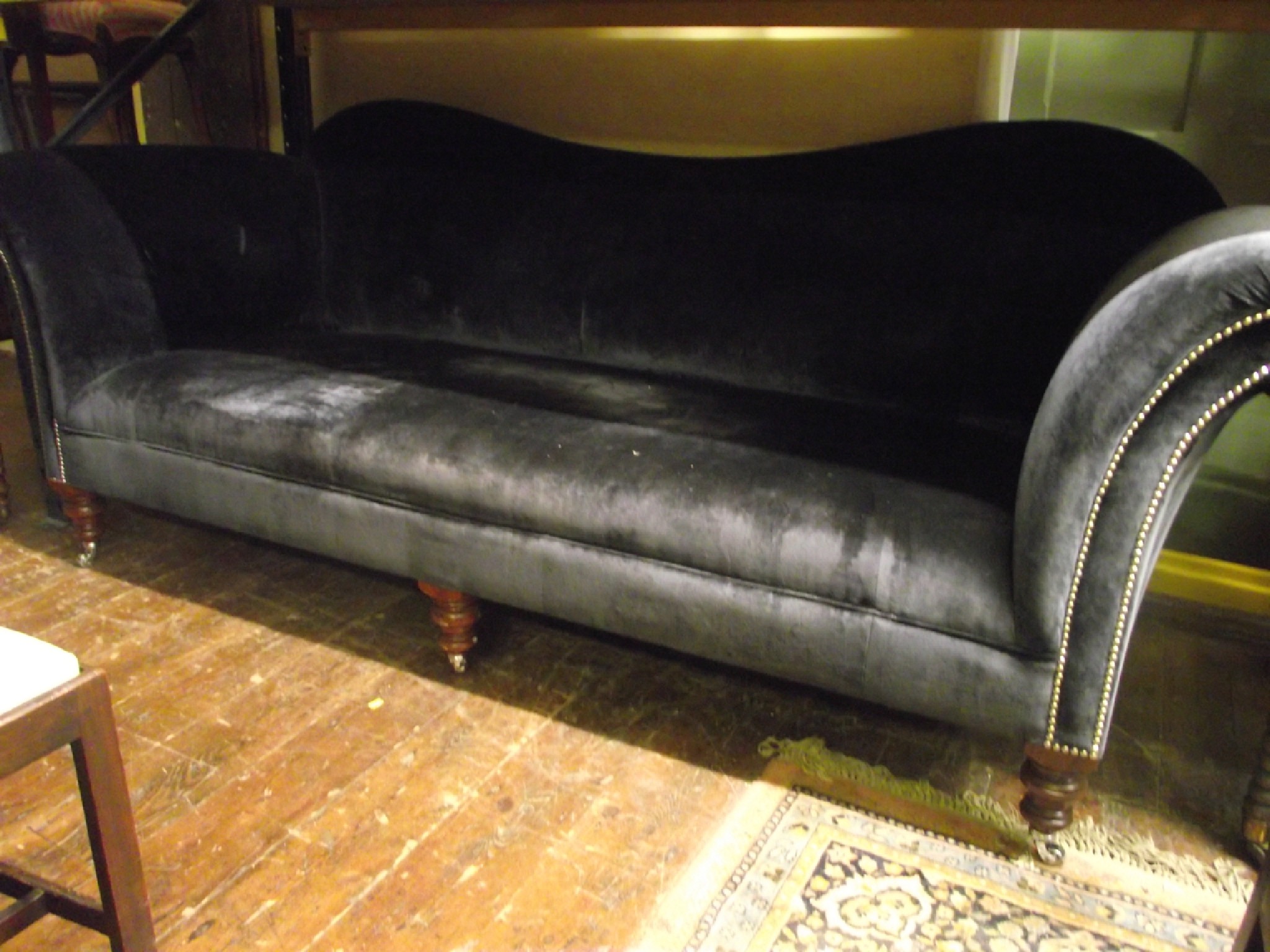 Appraisal: A large good quality sofa upholstered in a dark blue