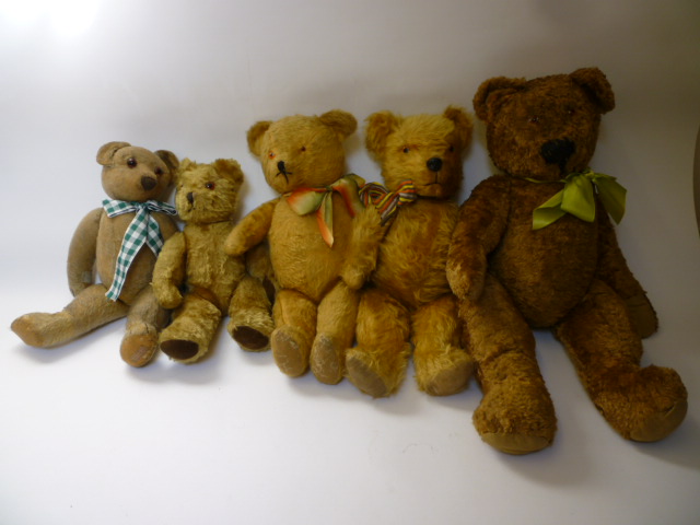 Appraisal: An English mid th century teddy bear covered in brown