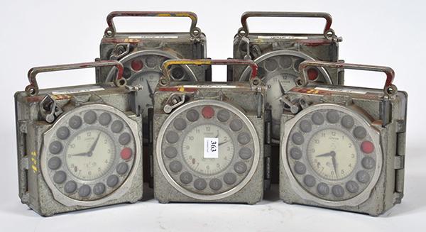 Appraisal: FIVE BELGIAN 'NATURAL ANTWERP JUNIOR' METAL CASED RACING PIGEON CLOCKS