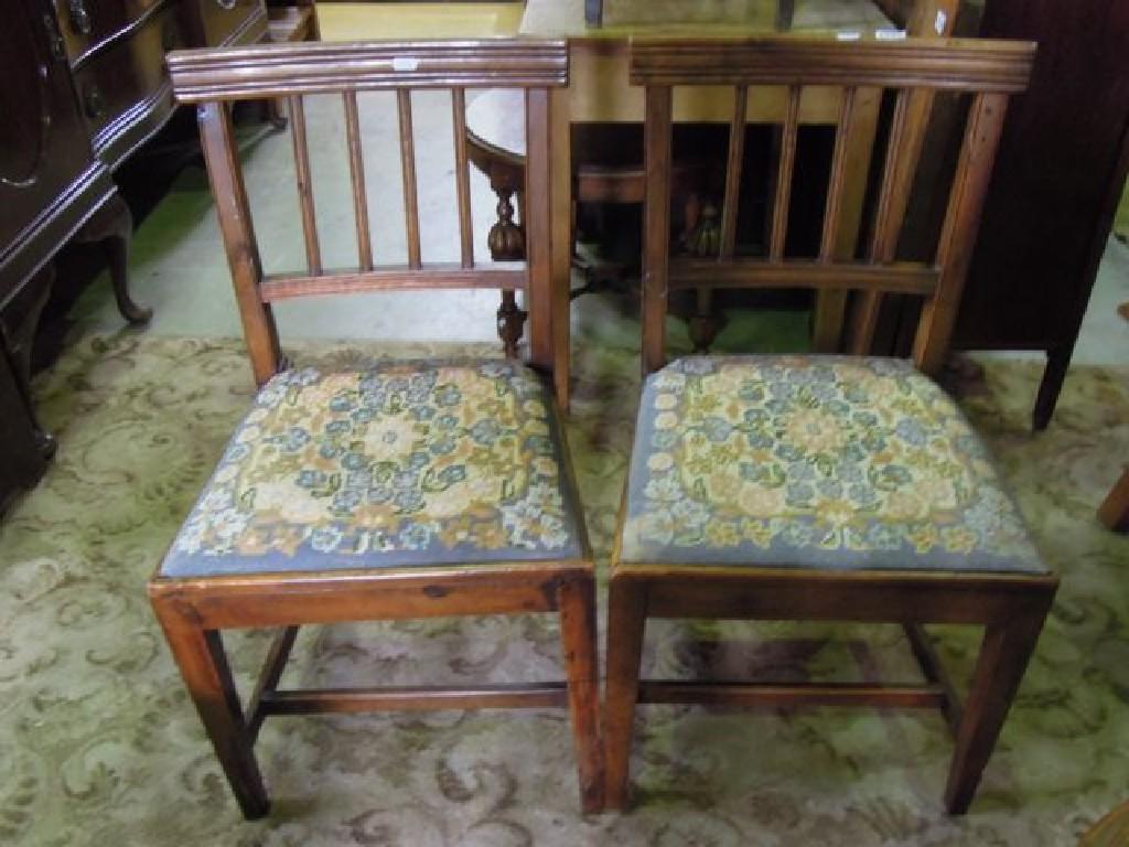 Appraisal: A pair of Georgian rail back dining chairs with drop