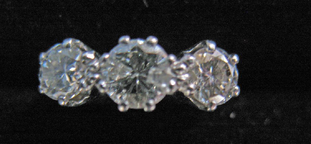 Appraisal: A THREE STONE DIAMOND RING the three round brilliant-cut diamonds