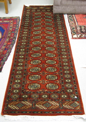 Appraisal: TWO BOKHARA AREA RUGS ' x ' red field runner