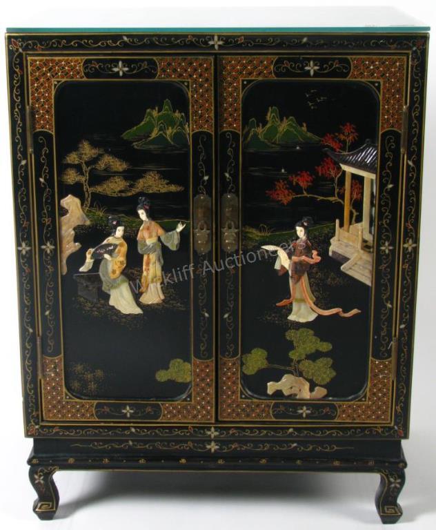 Appraisal: A black lacquer base cabinet Chinoiserie decoration with applied figural