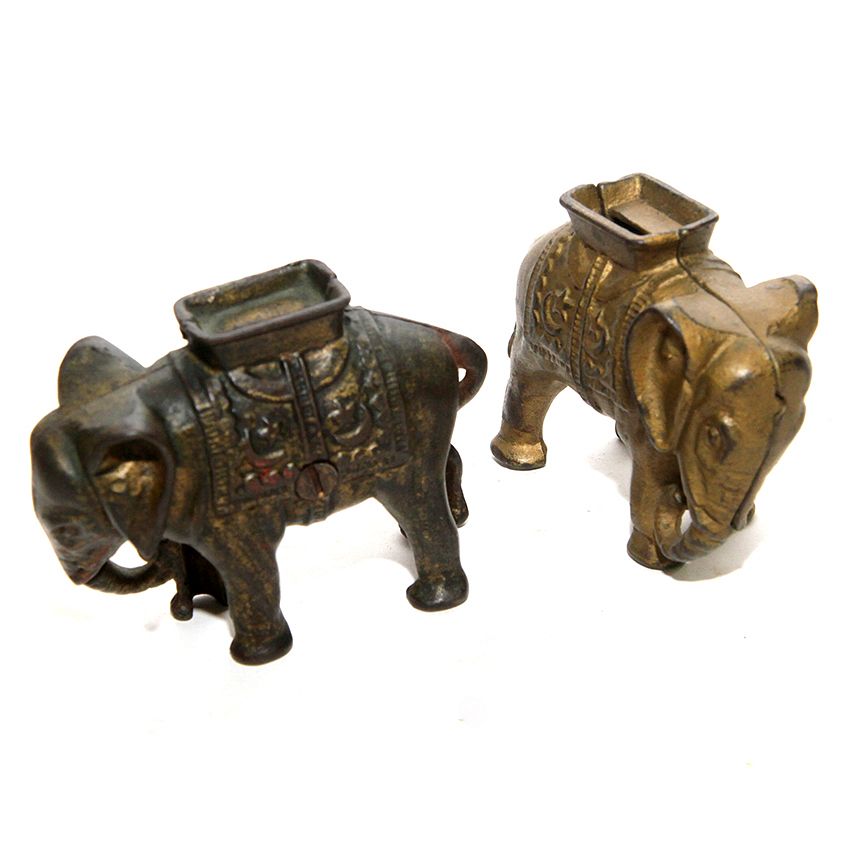 Appraisal: Pair of Elephant Banks Two nearly identical cast iron elephant