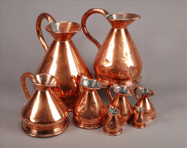 Appraisal: An associated set of eight graduated copper haystack measures th