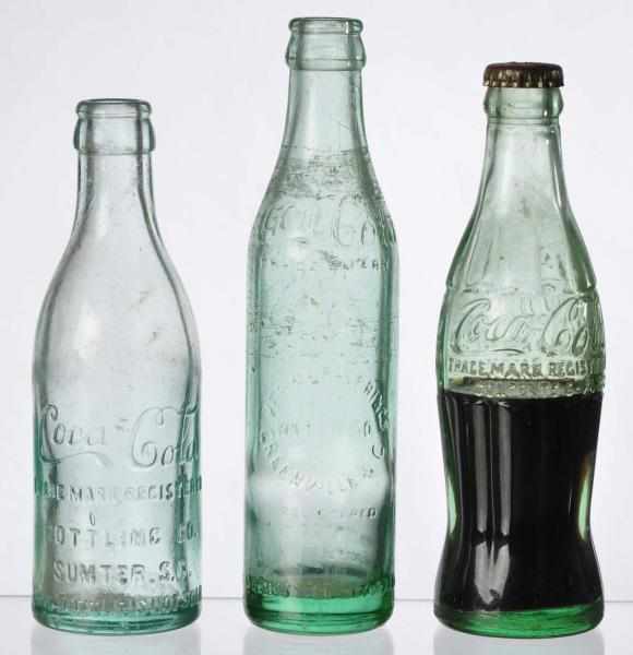 Appraisal: Lot of Coca-Cola Bottles Description Includes two straight sided Sumpter