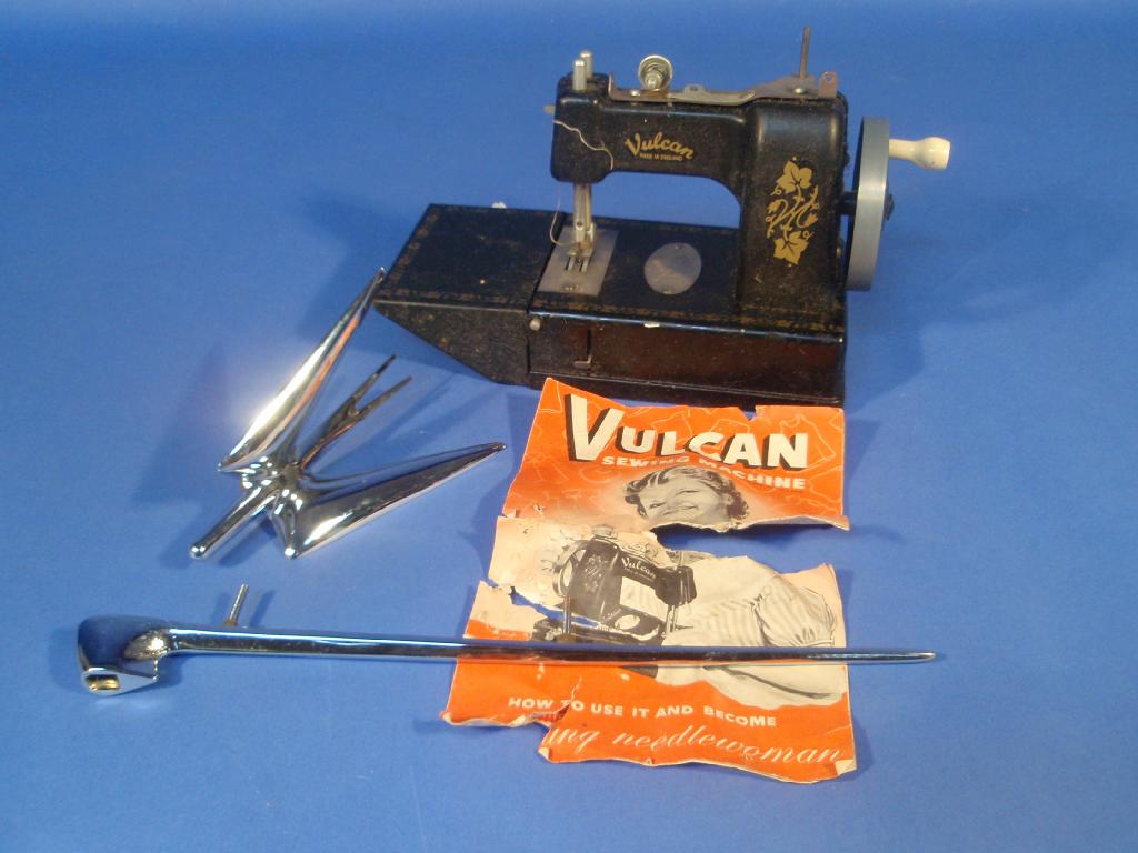 Appraisal: A Vulcan child's toy sewing machine and Dyna - wing