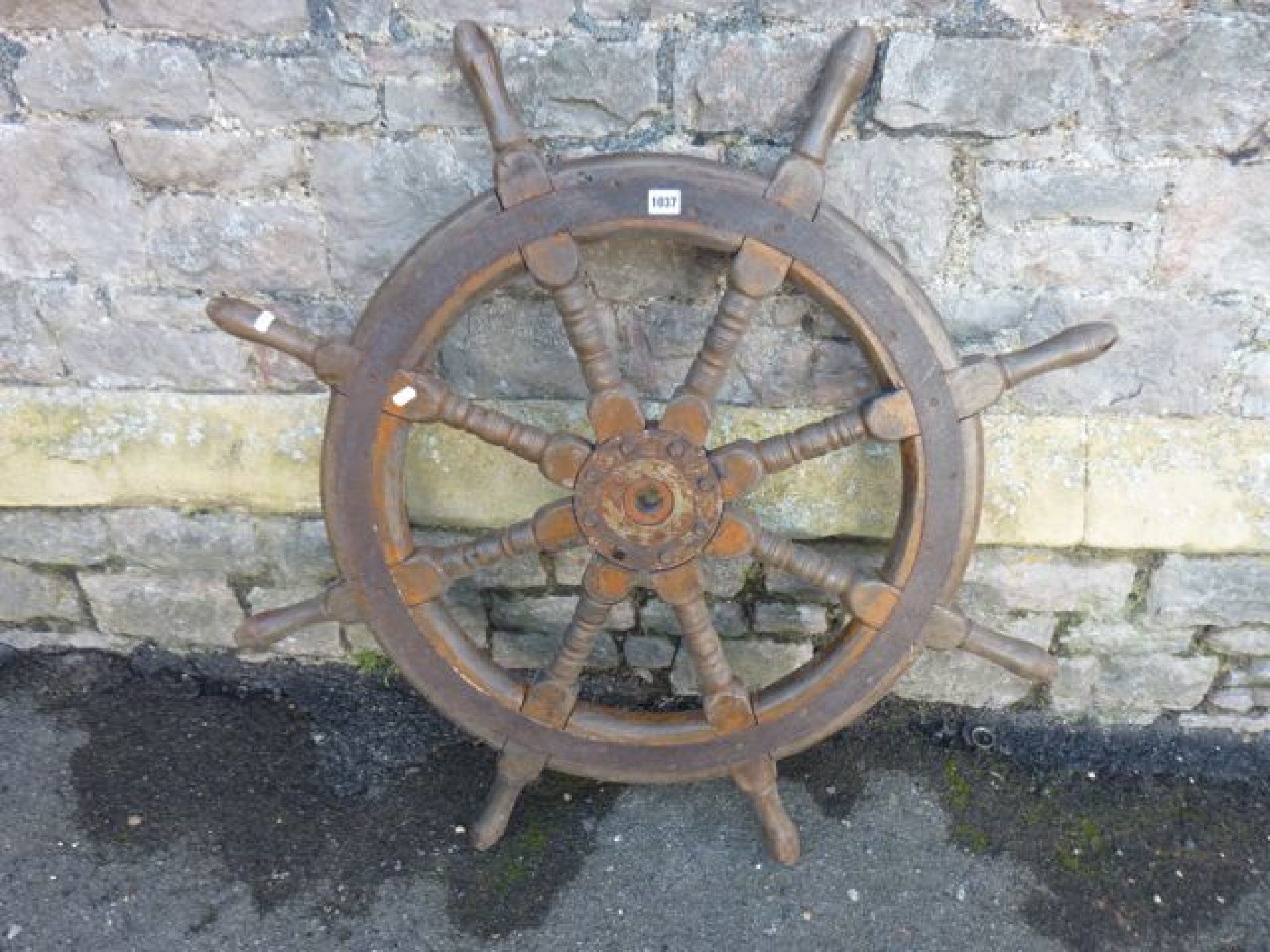 Appraisal: A teak and steel banded ship's wheel cm diameter