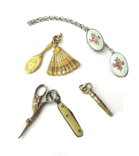 Appraisal: A gold cased miniature hand mirror a gold and enameled