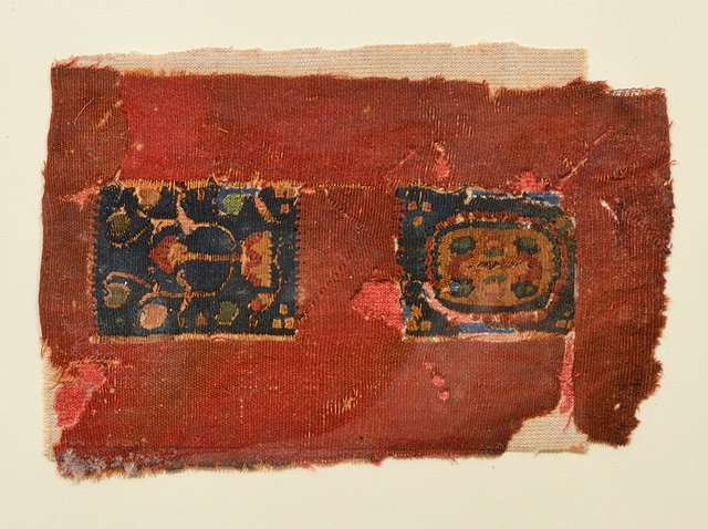 Appraisal: A RECTANGULAR FRAGMENT decorated two central polychrome foliate medallions on