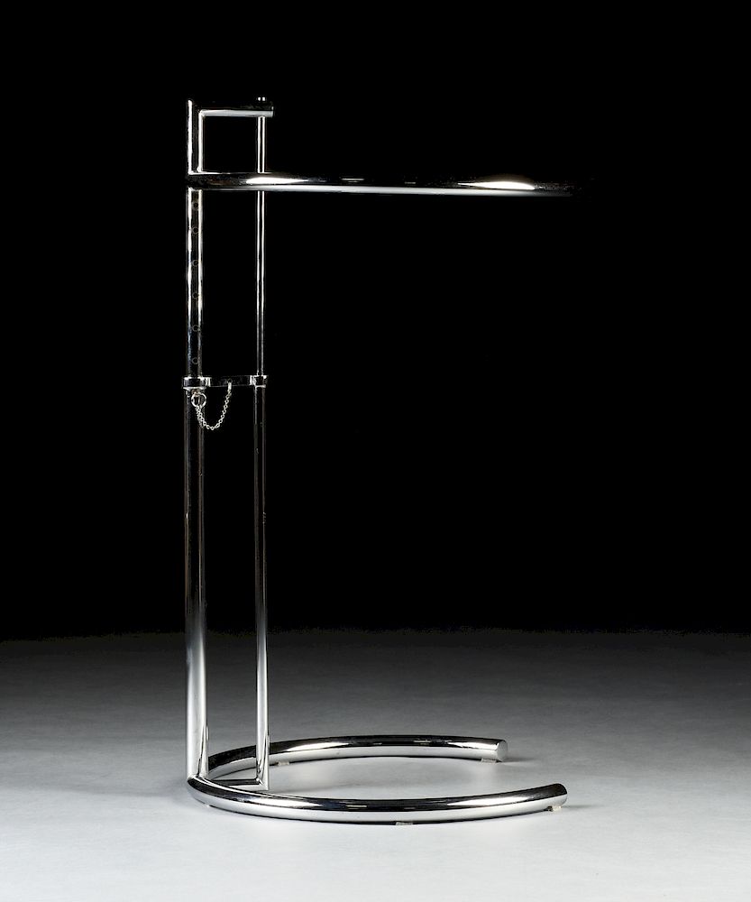 Appraisal: AN EILEEN GRAY ADJUSTABLE GLASS AND CHROME CIRCULAR SIDE TABLE