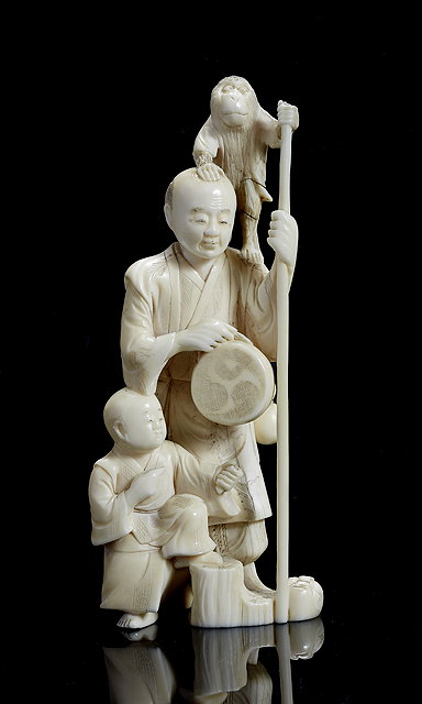 Appraisal: A Japanese ivory okimono of a SarumawashiMeiji period - holding