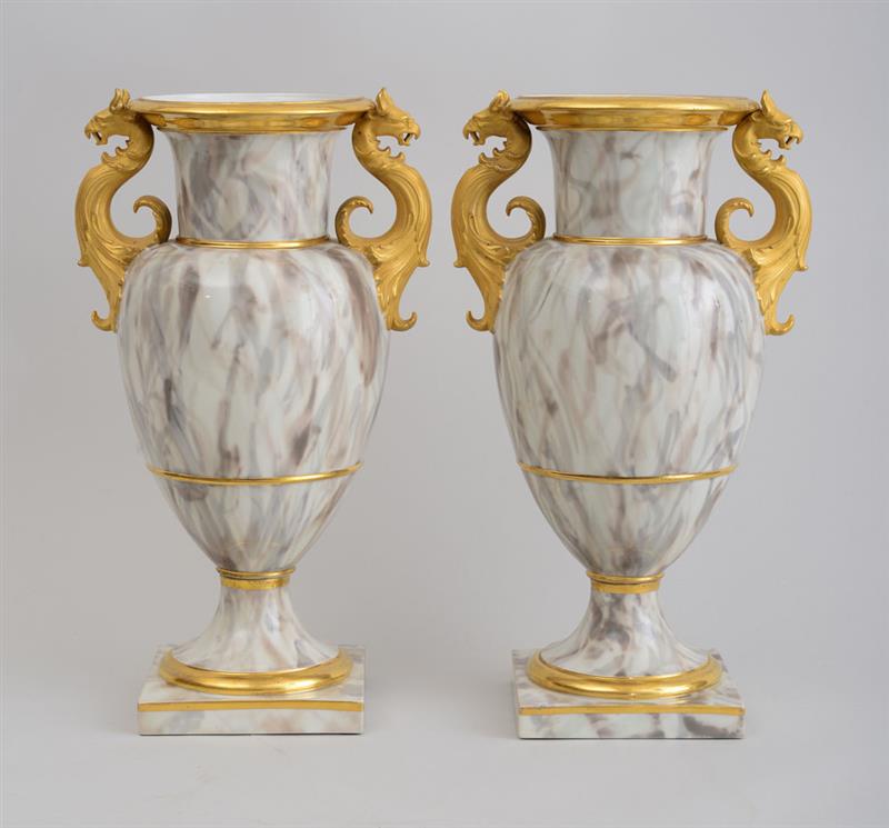 Appraisal: PAIR OF BERLIN MARBLEIZED PORCELAIN URNS Marked in underglaze blue