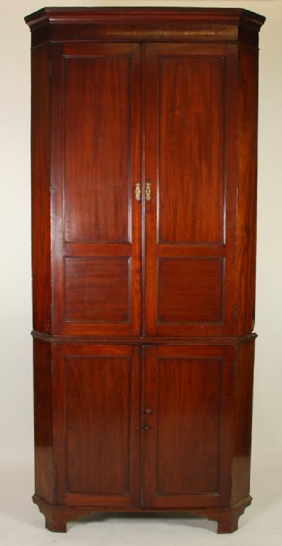 Appraisal: LARGE ANTIQUE MAHOGANY FLOOR STANDING DOUBLE CORNER CUPBOARD the cavetto