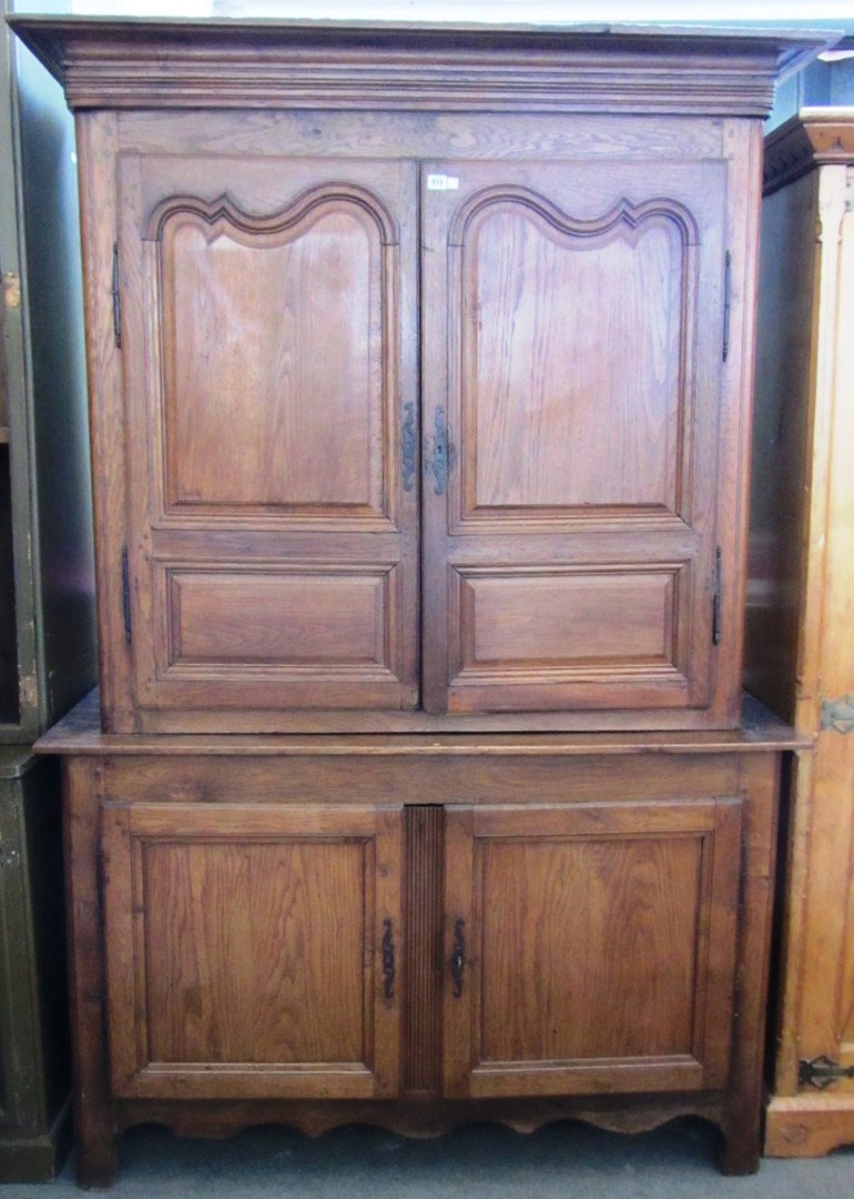 Appraisal: An early th century continental oak cupboard the pair of