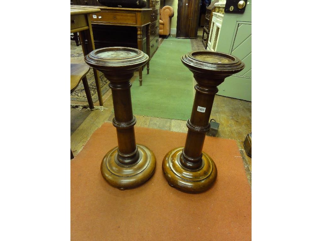 Appraisal: A pair of low th century mahogany torcheres with turned