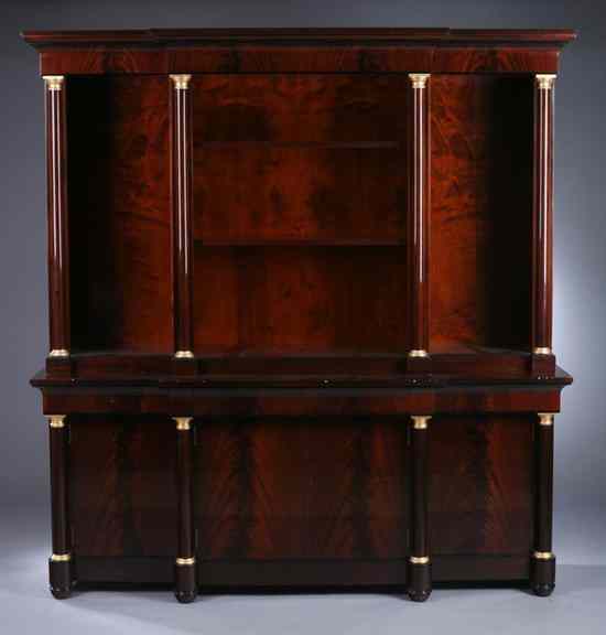 Appraisal: EMPIRE STYLE FLAME MAHOGANY BREAKFRONT BOOKCASE Upper section molded cornice