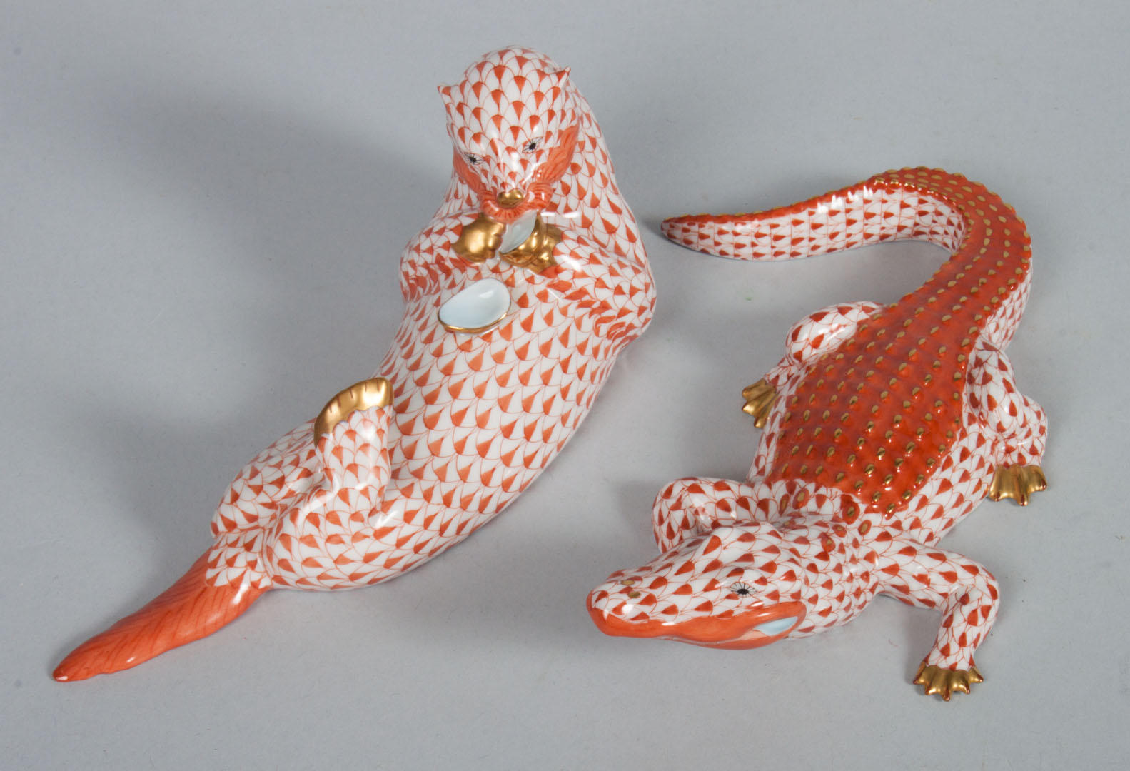 Appraisal: Herend porcelain otter alligator in the Rust Fishnet pattern otter