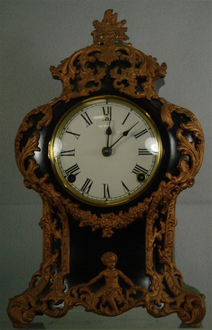 Appraisal: Gilbert black iron French style mantle clock runs strikes h