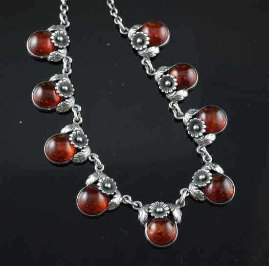 Appraisal: A Danish silver and amber necklace designed by N E