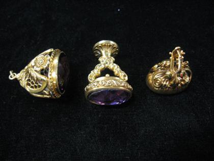 Appraisal: Three amethyst karat yellow gold watch fobs All of differing