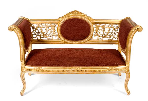 Appraisal: A carved gilt wood and upholstered settee height in width