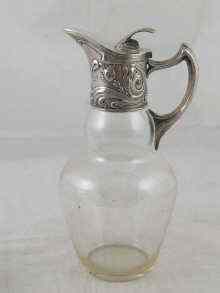 Appraisal: A Russian Art Nouveau claret jug the clear glass body