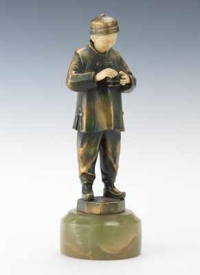 Appraisal: An Art Deco Asian Boy Statuette Cast brass statuette of