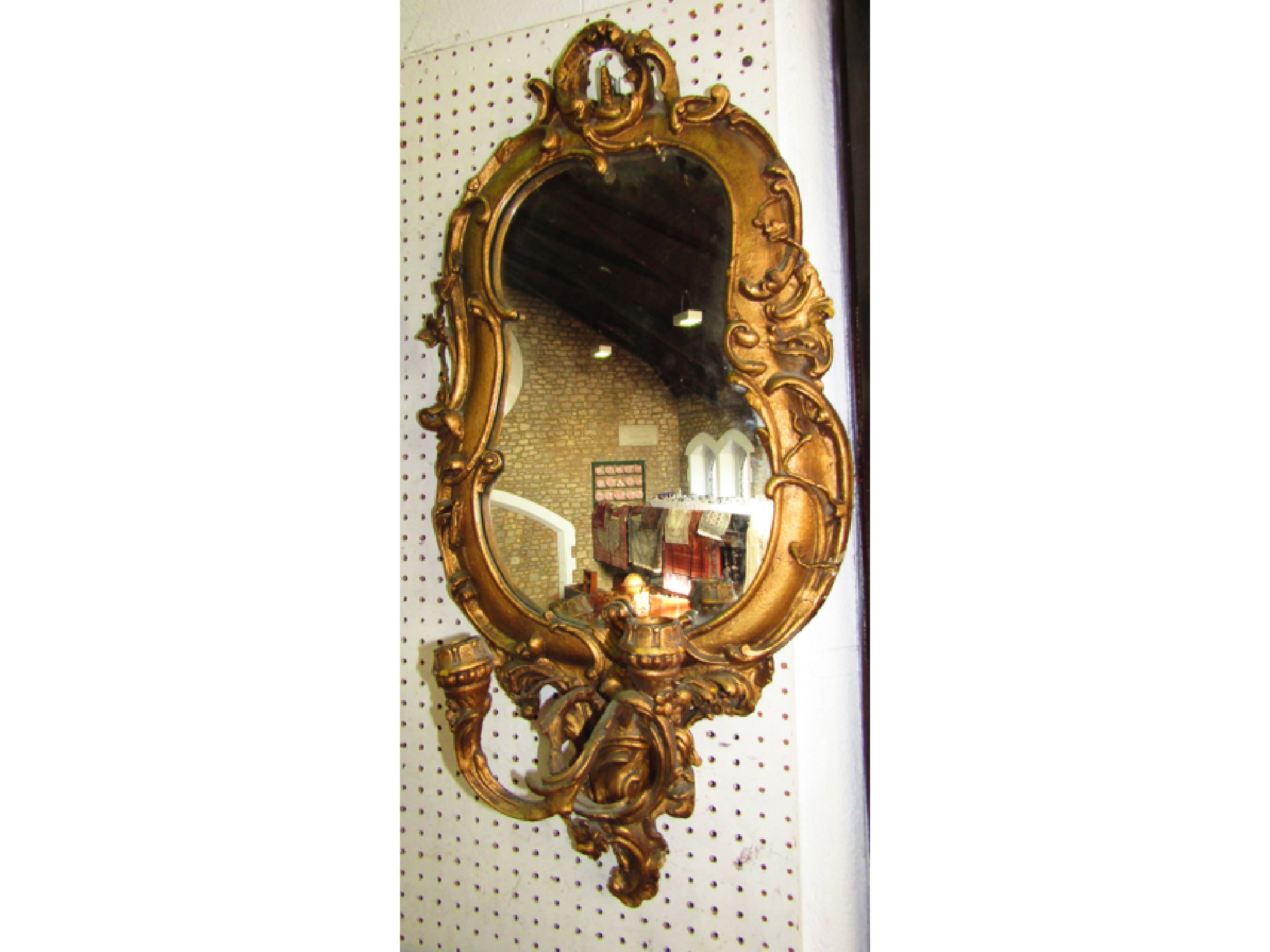 Appraisal: A gilt pear shaped wall mirror with scrolling acanthus detail