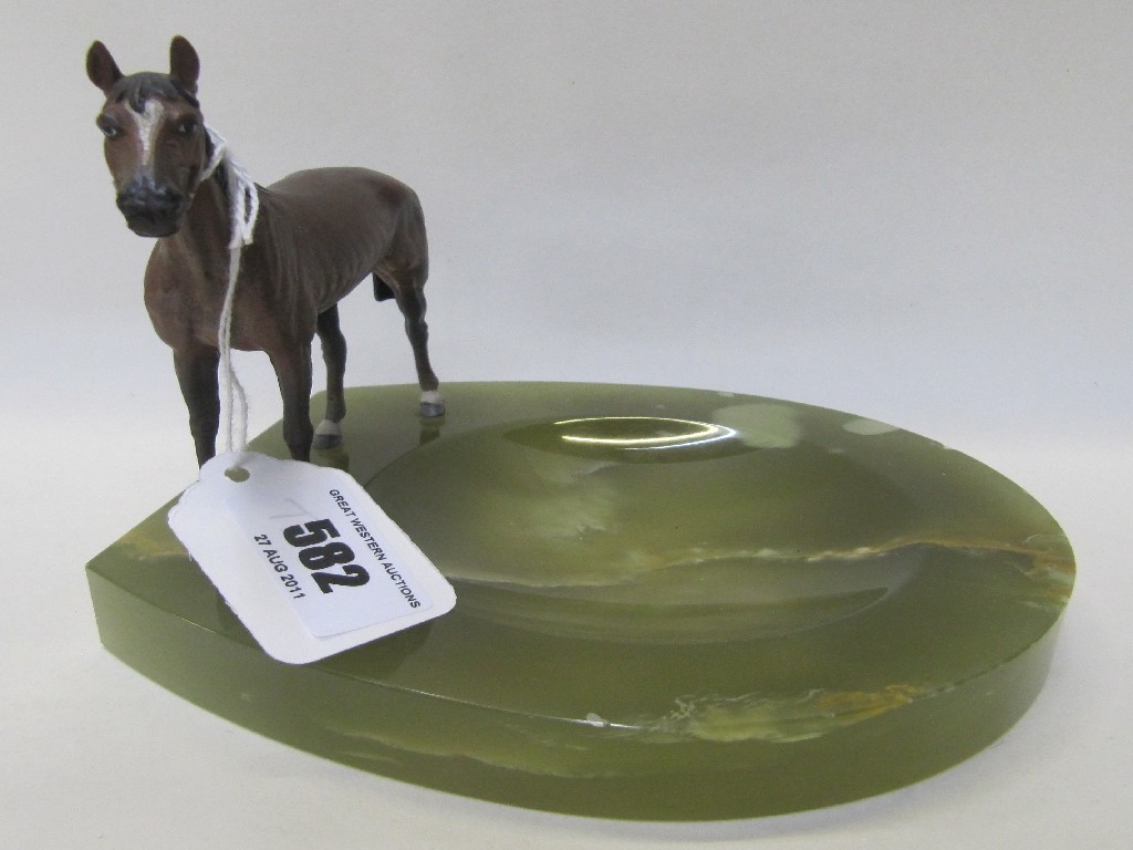 Appraisal: Onyx horseshoe shaped ashtray with mounted spelter horse