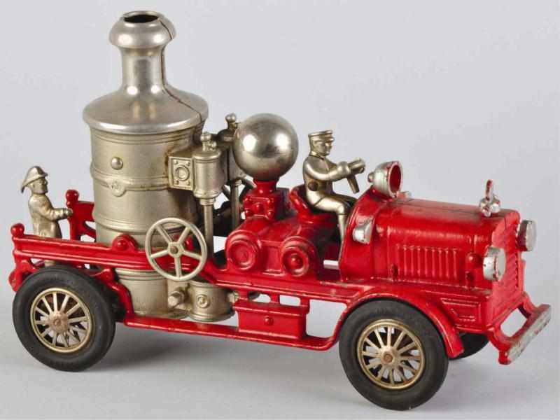 Appraisal: Cast Iron Hubley Fire Pumper Toy Description All original including