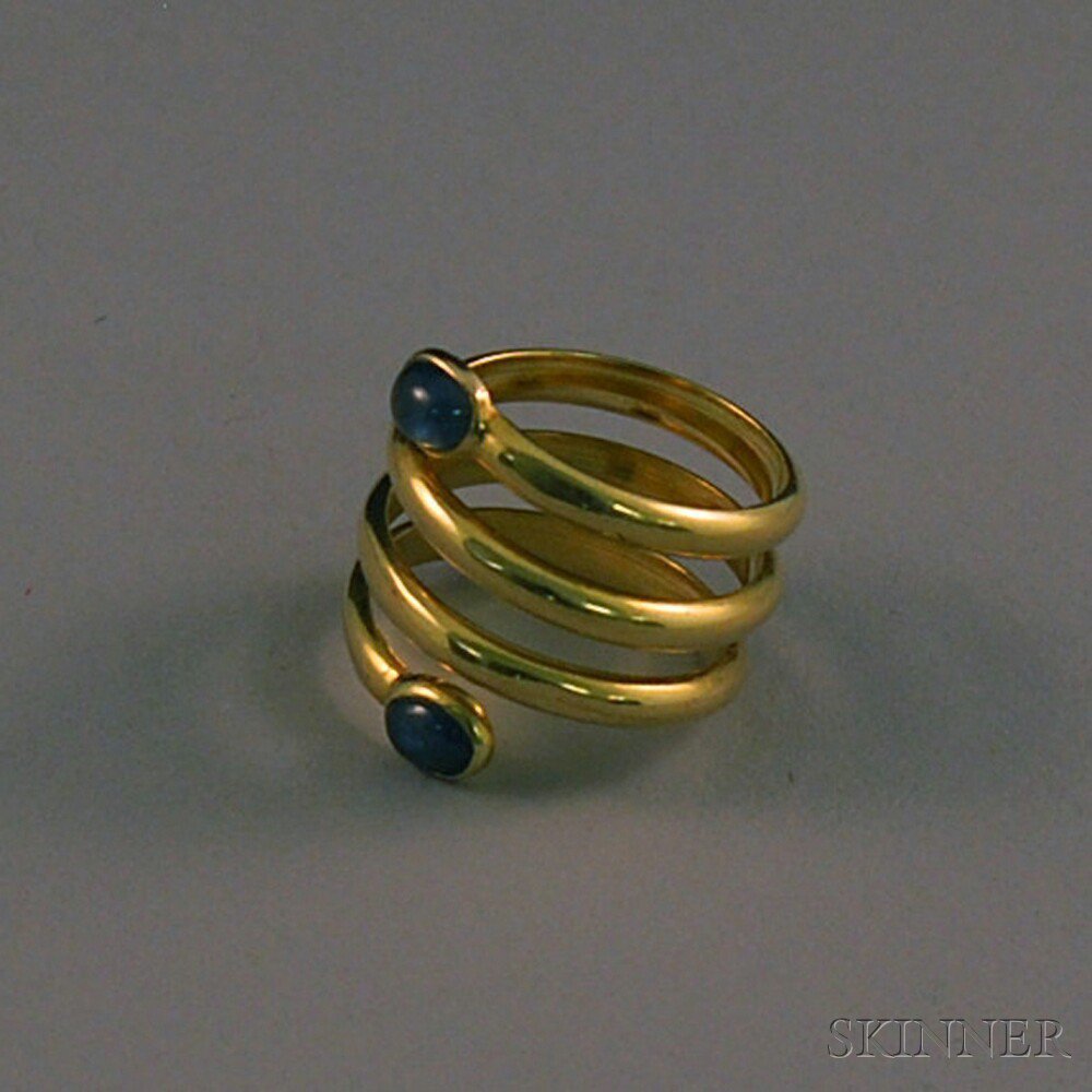 Appraisal: Cartier kt Gold and Blue Cabochon Snake-type Ring the coiled