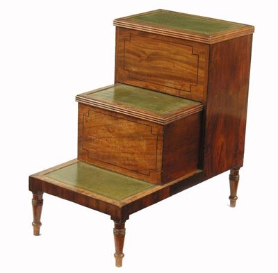 Appraisal: A Regency mahogany step commode with replaced leather treads the