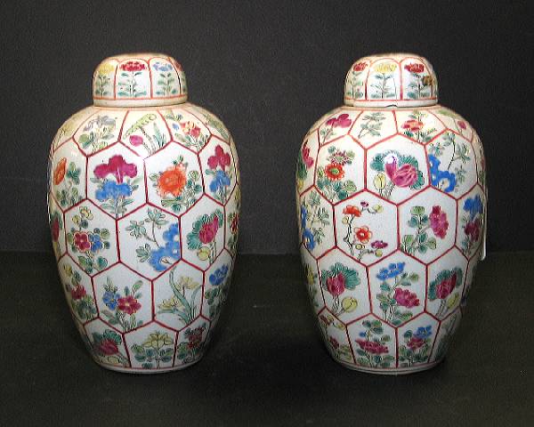 Appraisal: A pair of famille rose enameled porcelain lidded jars Each