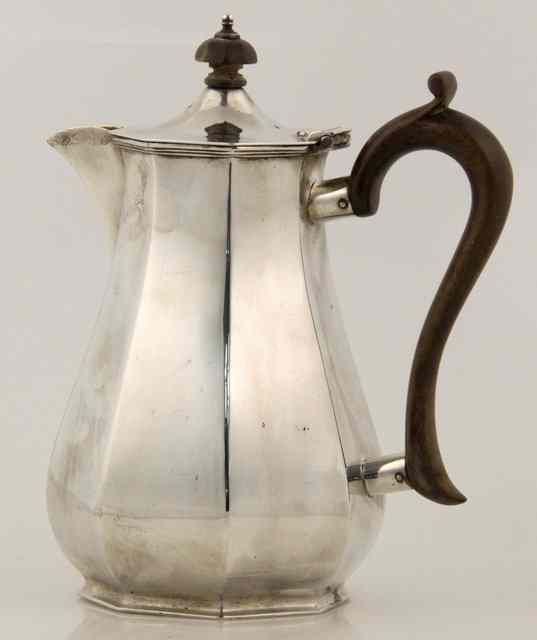 Appraisal: An octagonal silver coffee pot Mappin and Webb Sheffield of