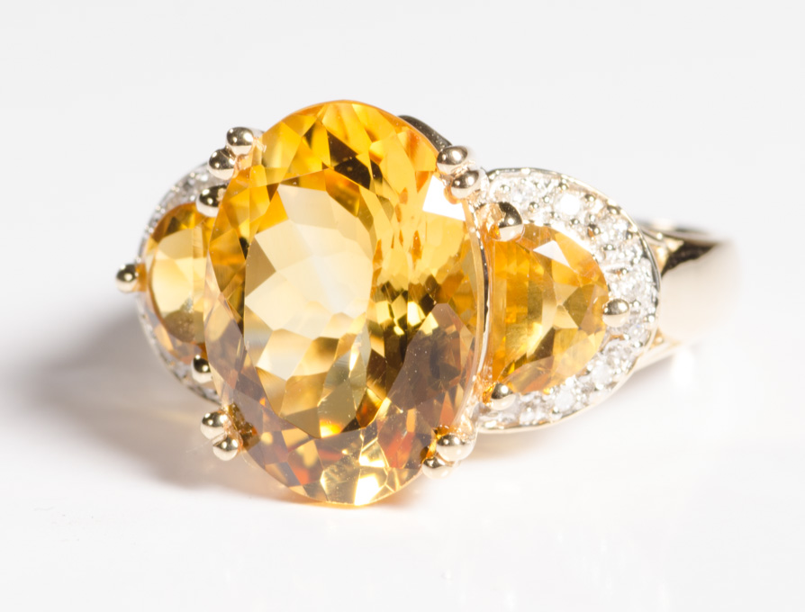 Appraisal: CITRINE DIAMOND AND FOURTEEN KARAT GOLD RING centering a large