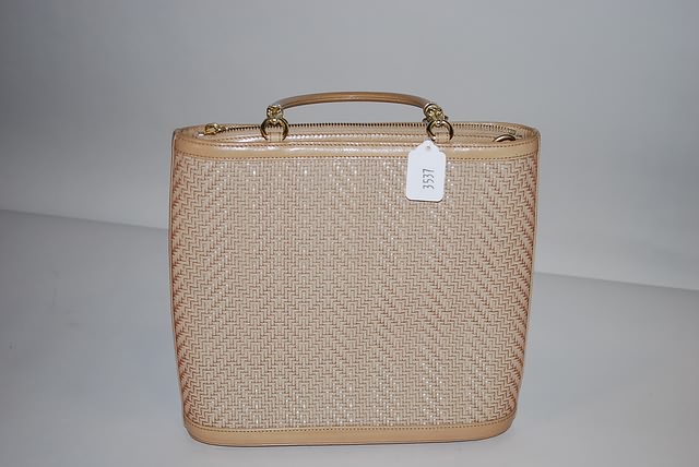 Appraisal: Barry Kieselstein-Cord tan woven leather handbag with signature accents and