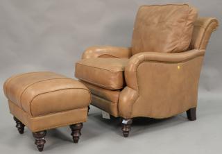 Appraisal: Brown leather chair and ottoman Brown leather chair and ottoman