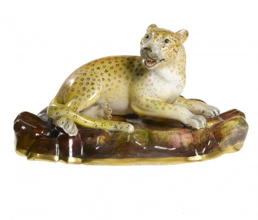 Appraisal: A STAFFORDSHIRE PORCELAIN MODEL OF A LEOPARD AT LODGE painted