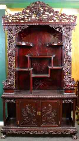 Appraisal: A Fine Chinese Carved Rosewood EtgereFinely carved two-piece rosewood etagere